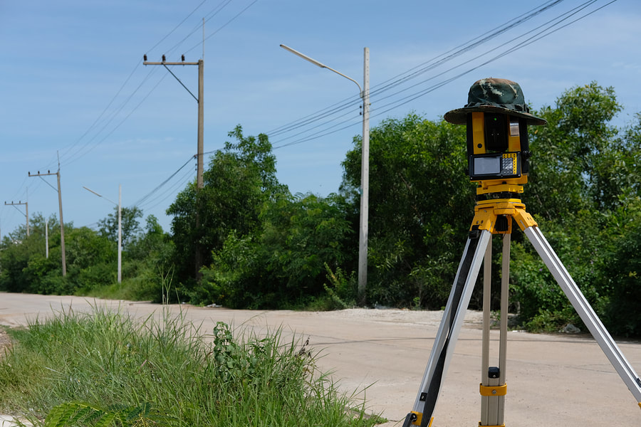 putting the land surveying equipment on the road